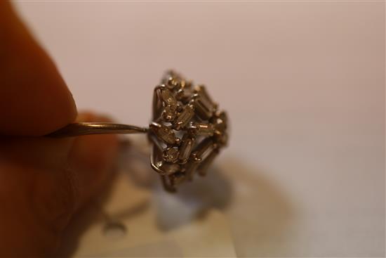 A diamond cluster ring set with brilliants, navette and baguette stones, 18ct white gold and platinum setting, size T.